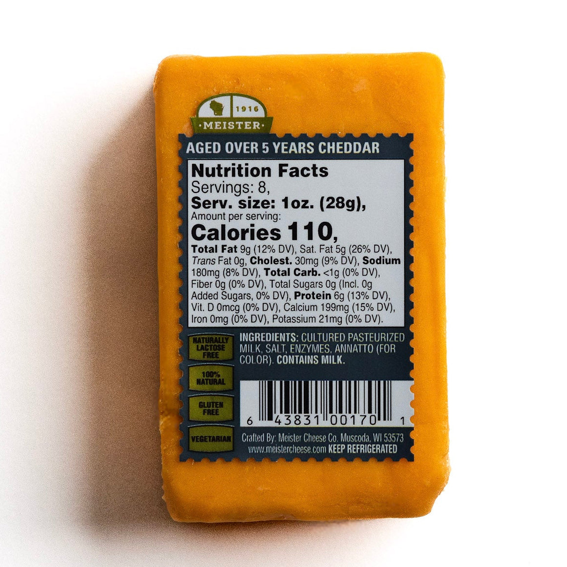 block of Meister aged cheddar cheese with nutrition label