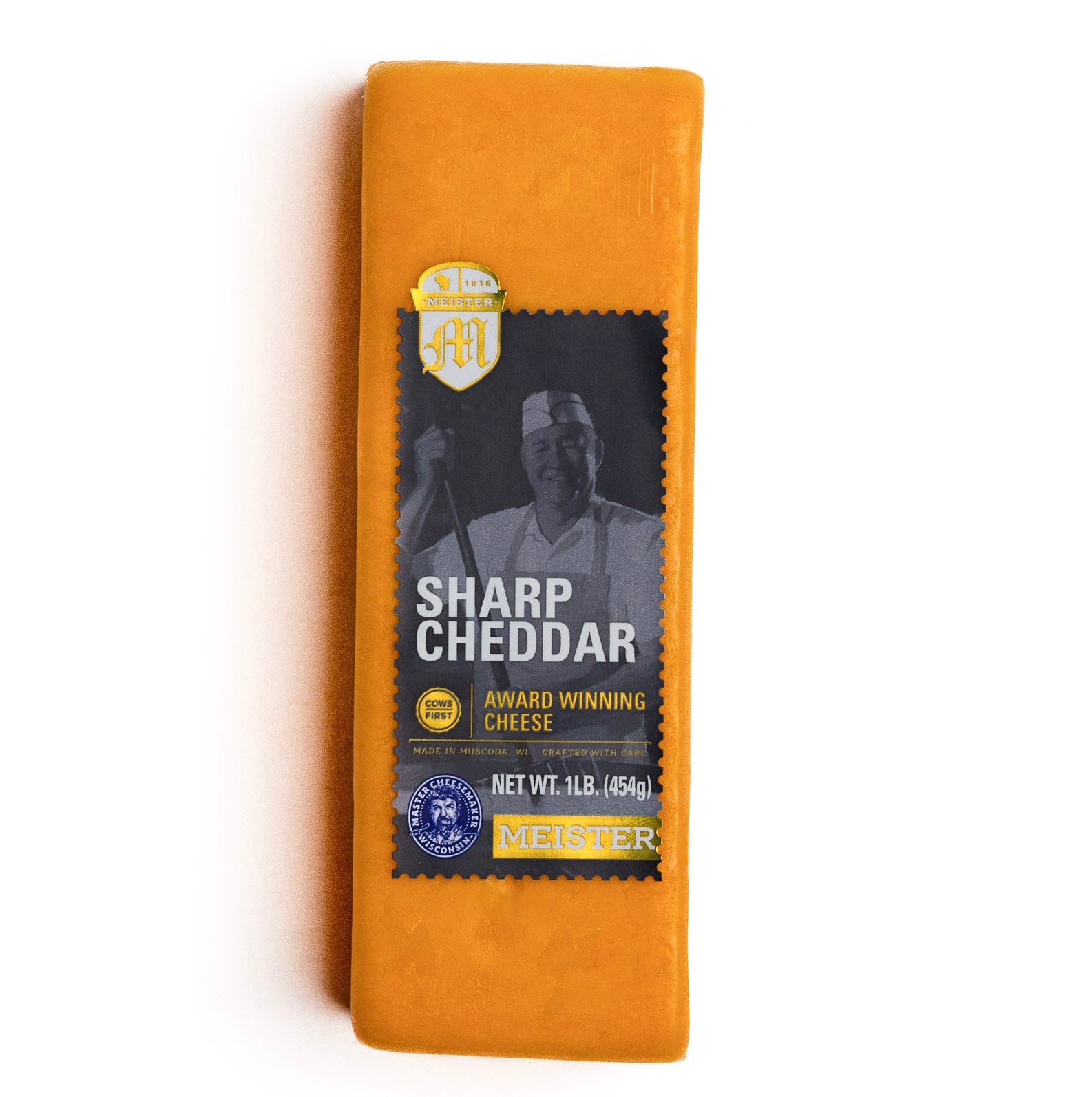 Block of Meister sharp cheddar cheese