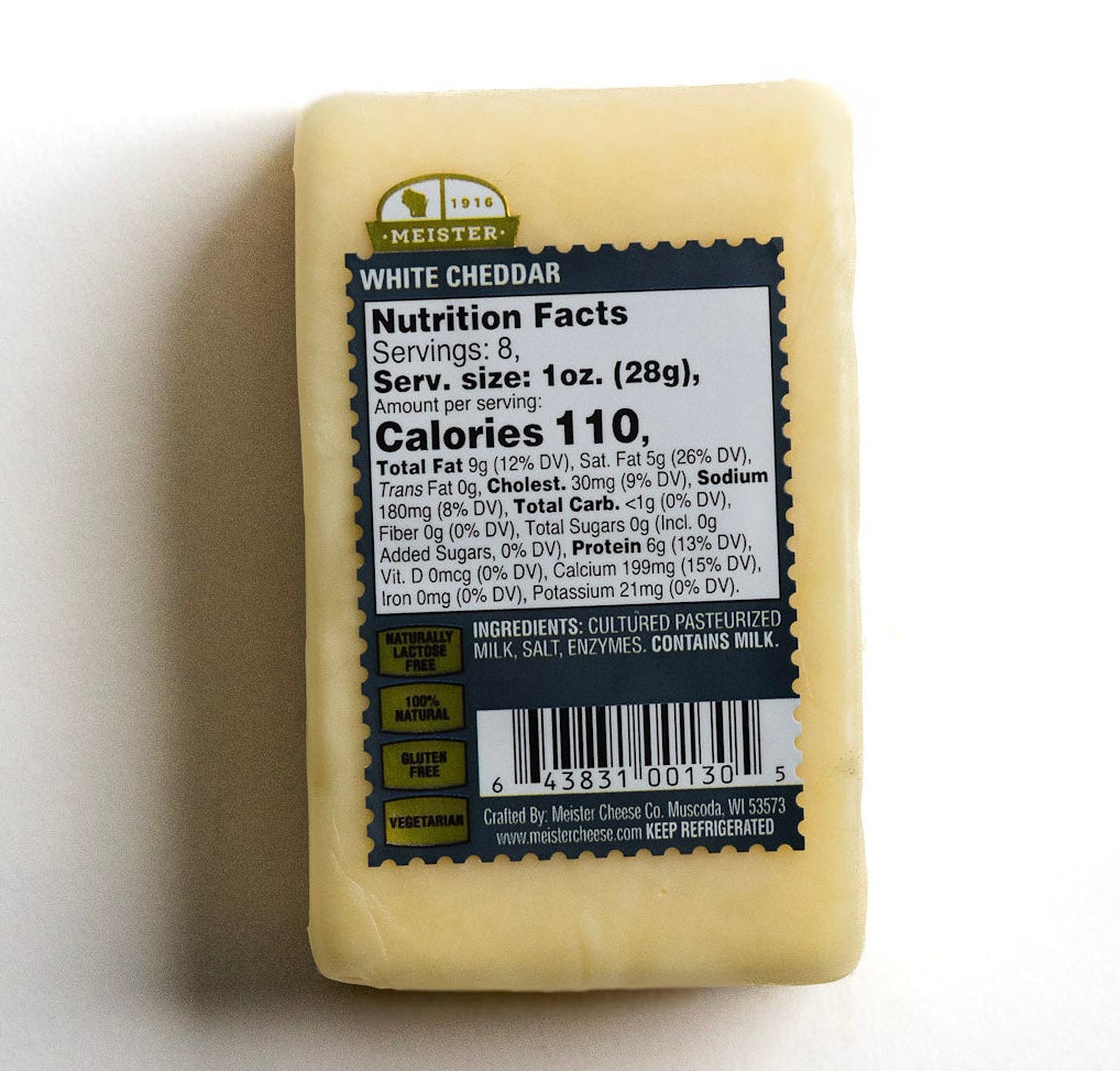 Block of Meister white cheddar cheese with a nutrition facts label