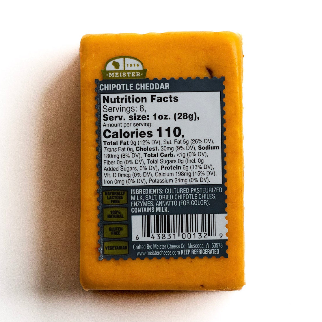 block of Meister Chipotle Cheddar cheese with nutrition facts panel