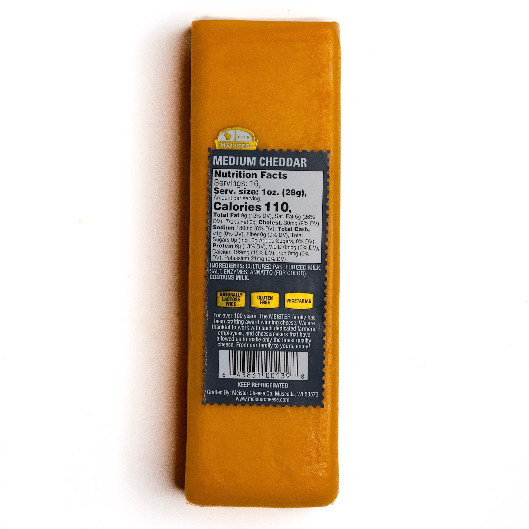 Block of Meister Medium cheddar cheese with a nutrition label 
