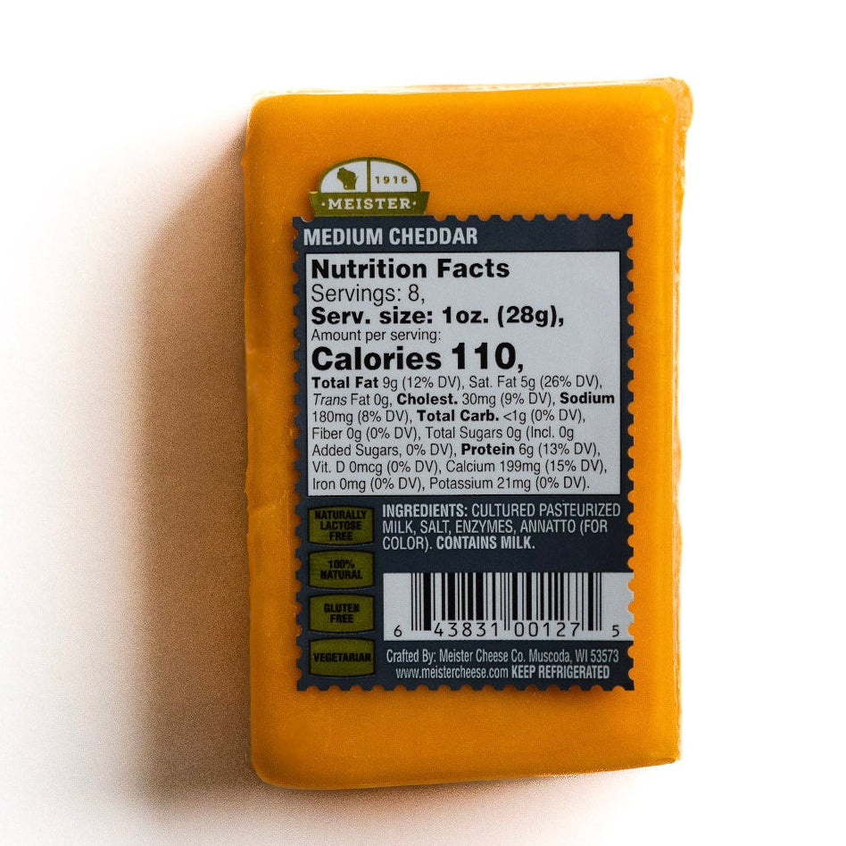 Block of Meister Medium cheddar cheese with a nutrition facts label 