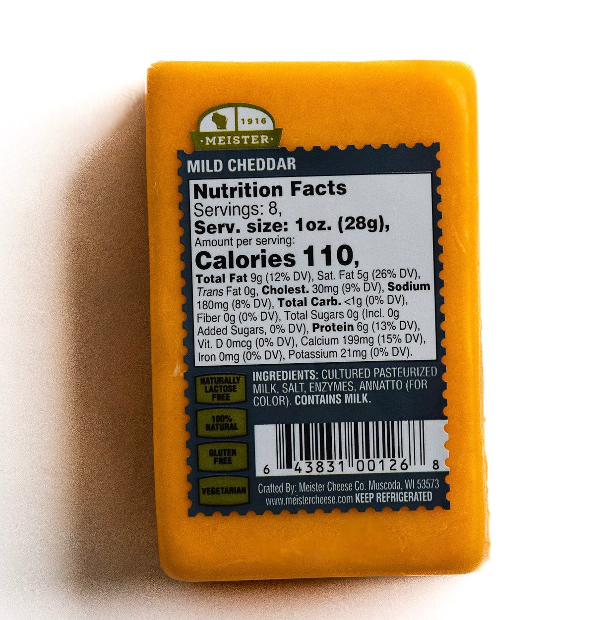 Block of Meister cheddar cheese with a nutrition facts label