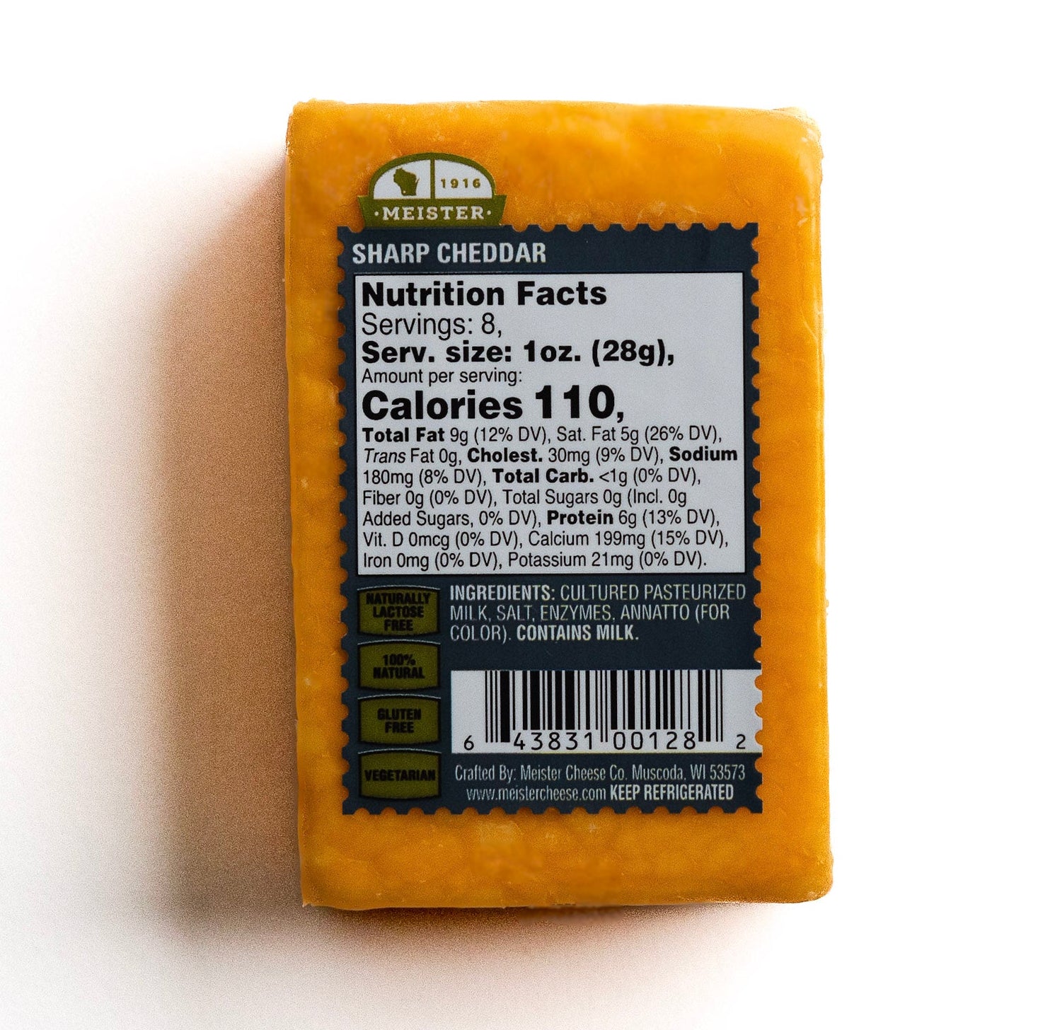 Block of Meister sharp cheddar cheese with a nutrition facts label 