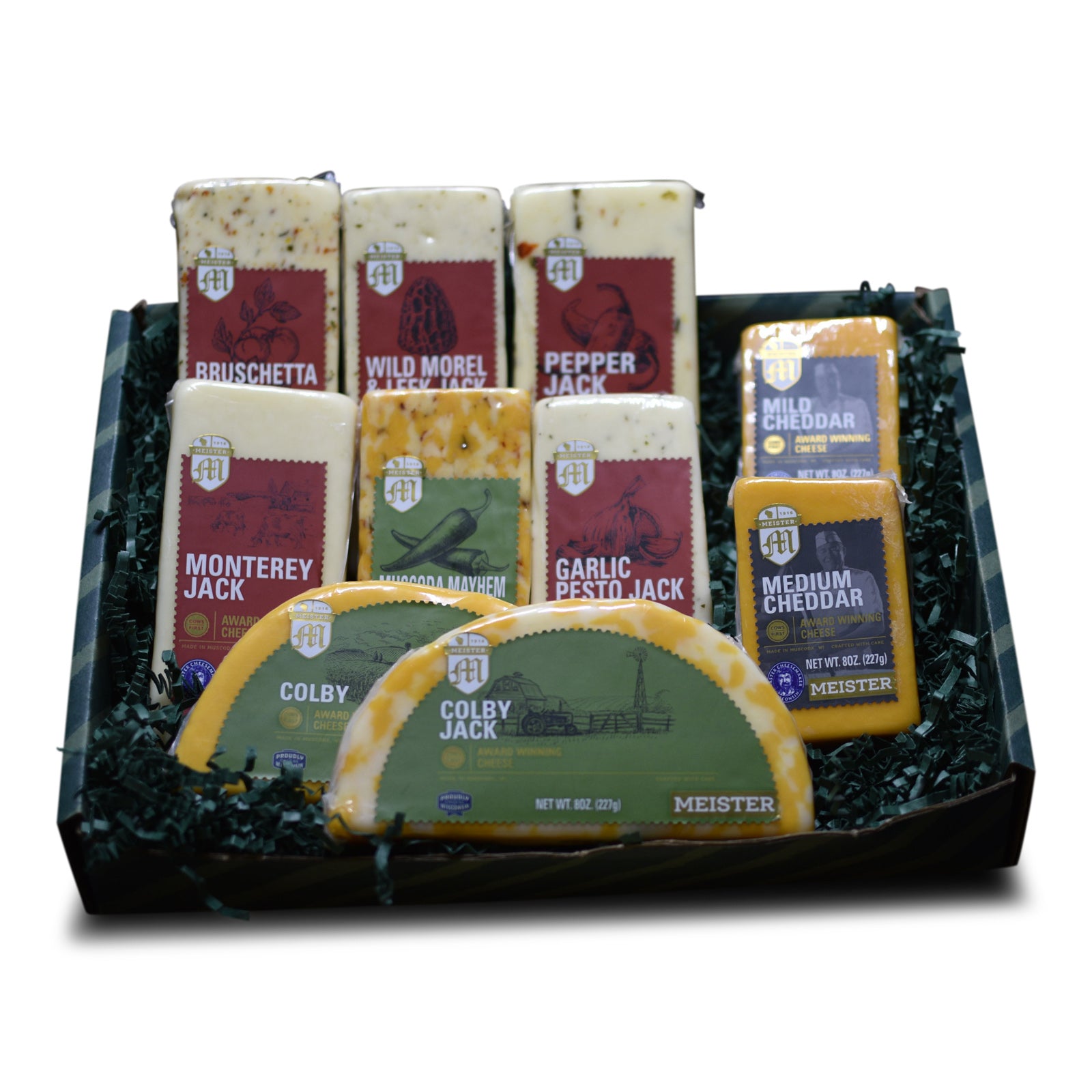 A selection of Meister cheese varieties arranged in a box, with labels showing the specific cheese flavor, such as Bruschetta Jack and Garlic Pesto Jack.